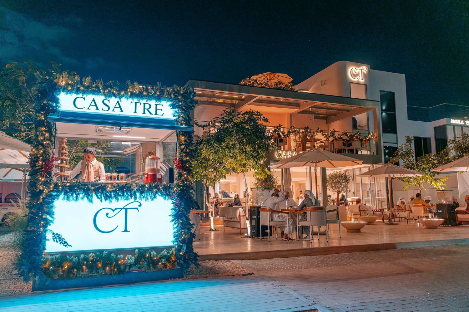 Casa Tré: storefront at night